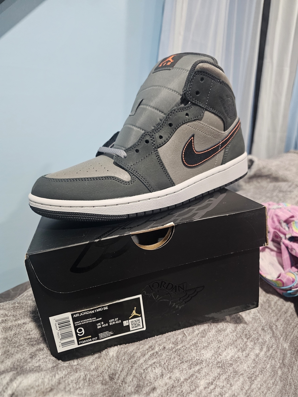 Jordan Mid-Top Sneakers in Gray with Orange Stitching